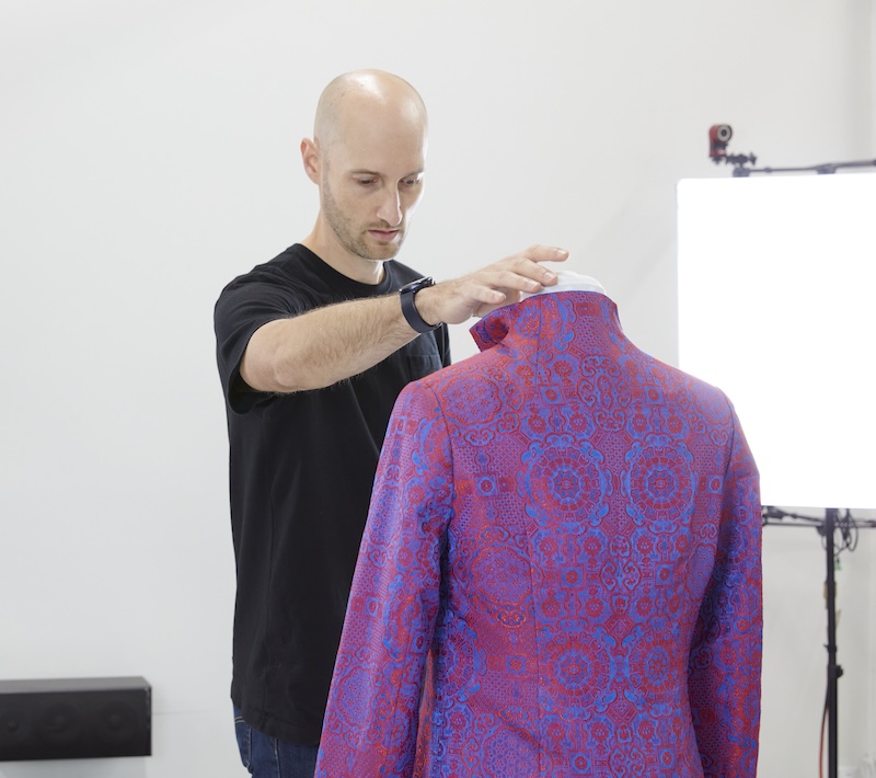 Ian looking at Red Ochi jacket while scanning with Monocle Prime